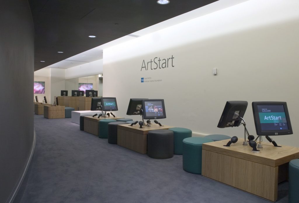 The National Gallery's ArtStart Room, showing a series of collection information touch-screen kiosks with audio wands, and leather stools.